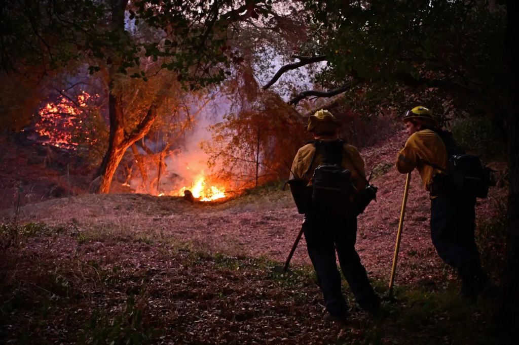 Firefighters race to beat Los Angeles blazes as winds grow,