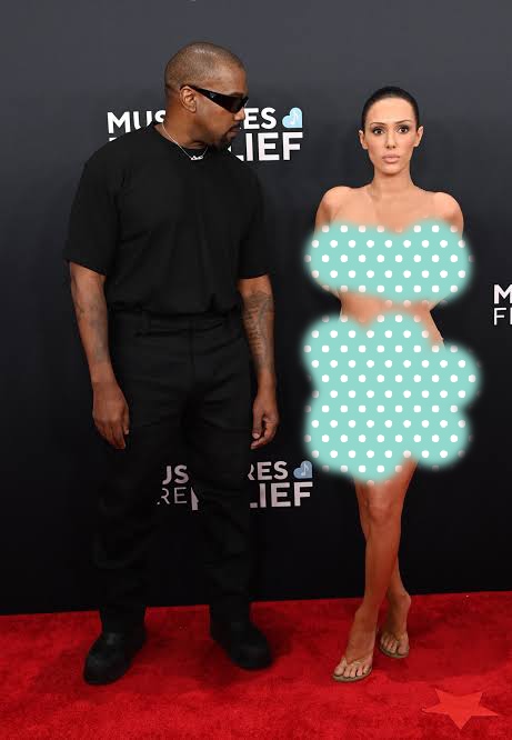 Rapper Kanye West and his wife, Bianca Censori, were reportedly escorted out of the 67th annual GRAMMY Awards after arriving uninvited. Bianca Censori showed up fully n#ked…. See pictures ???? ???? Rapper Kanye West and his wife, Bianca Censori, were reportedly escorted out of the 67th annual GRAMMY Awards after arriving uninvited. Bianca Censori showed up fully n#ked…. See pictures ???? ???? - Fi