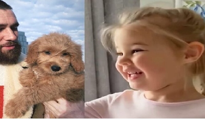 Uncle Travis gifted his niece an adorable golden furry friend,