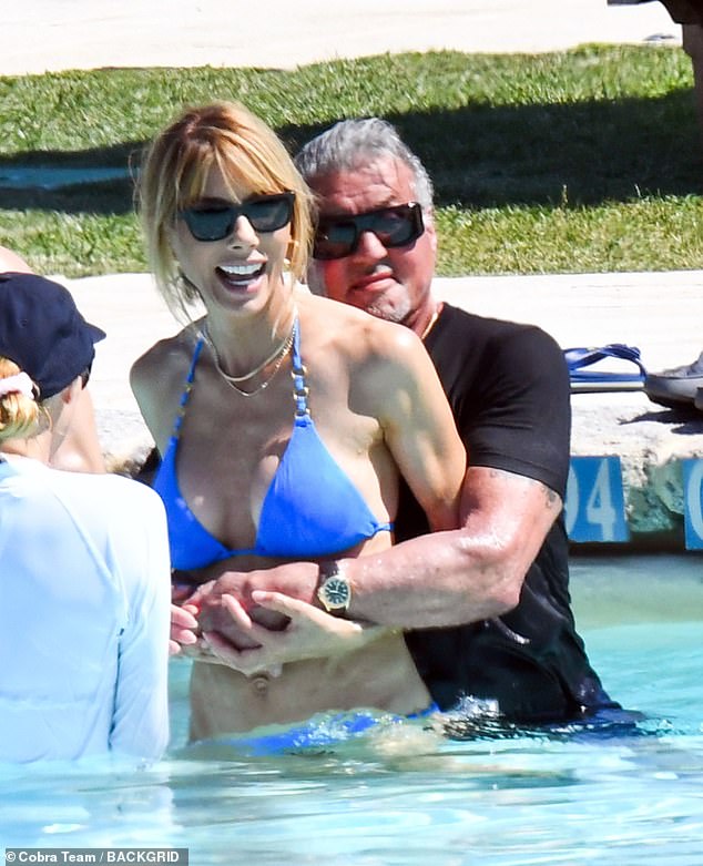 Sylvester Stallone is pictured enjoying himself in the pool with his wife 10 months after they called it quits